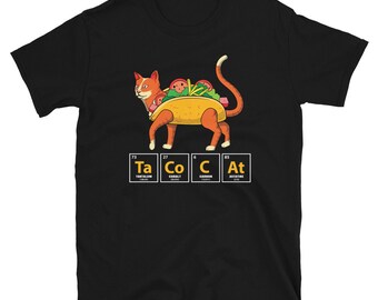 May include: Black t-shirt featuring a cartoon cat designed as a taco, with the word "TACO CAT" spelled out using periodic table elements. The cat is orange with a yellow taco shell and taco toppings.