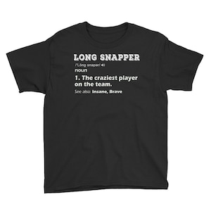 May include: Black t-shirt with white text that reads "LONG SNAPPER /'Long snaper/40 noun 1. The craziest player on the team. See also: Insane, Brave"