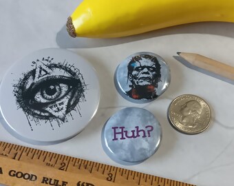 3 Piece Novelty Pin Set - Fun & Unique "the Grey Monsters are Watching Us" Pinback Buttons: Third Eye, Graphic Frankenstein, "Huh?"