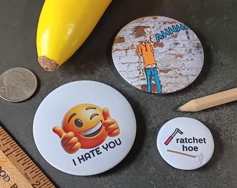 3 Piece "Major Attitude" Novelty Pin Set - 3 Graphic Pinback Buttons: I Hate You Smiley Face Emoji, Screaming Lunatic, Ratchet Hoe (tools)