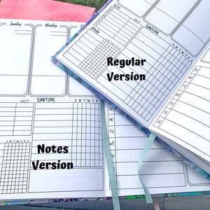 May include: Two open notebooks with different layouts. The top notebook has a "Regular Version" label and the bottom notebook has a "Notes Version" label. Both notebooks have sections for sleep, symptoms, and daily notes.
