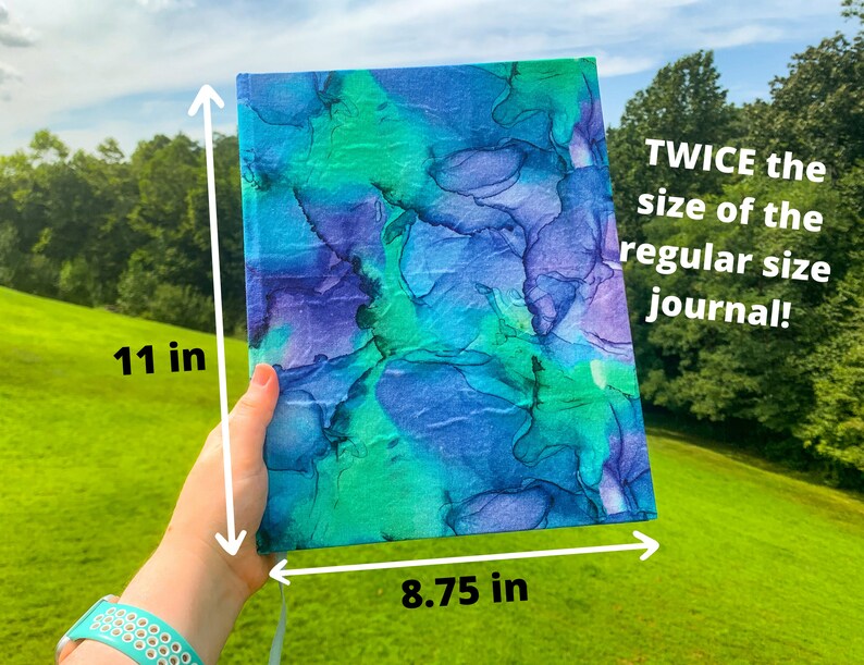 May include: A large, blue and green journal with a marbled cover. It measures 11 inches tall and 8.75 inches wide. The text on the journal reads "TWICE the size of the regular size journal!"