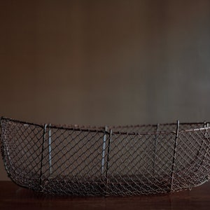 Old hand made wire basket, time worn and rustic, farmhouse decor