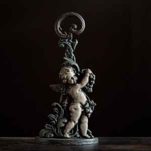 Antique cast iron cherub doorstop, putto with grapes and foliage, traditional home decor