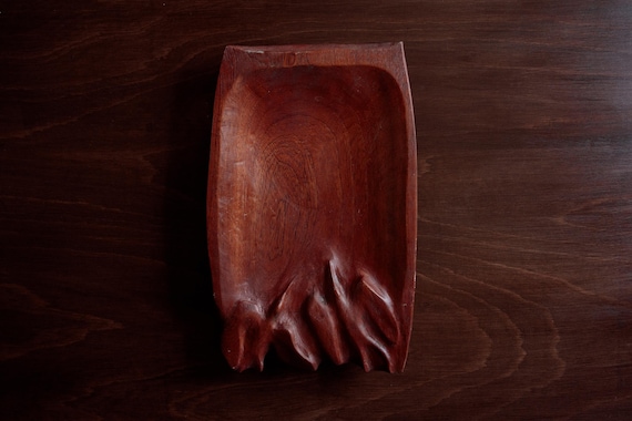 A genuinely one-of-a-kind antique-style hand-carved wooden bowl with intricate bird detailing — old-world craft you won't find twice.