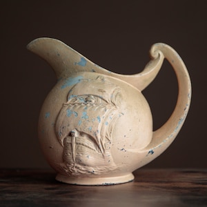 Old sailing ship pottery jug, age worn ceramic pitcher, nautical home decor
