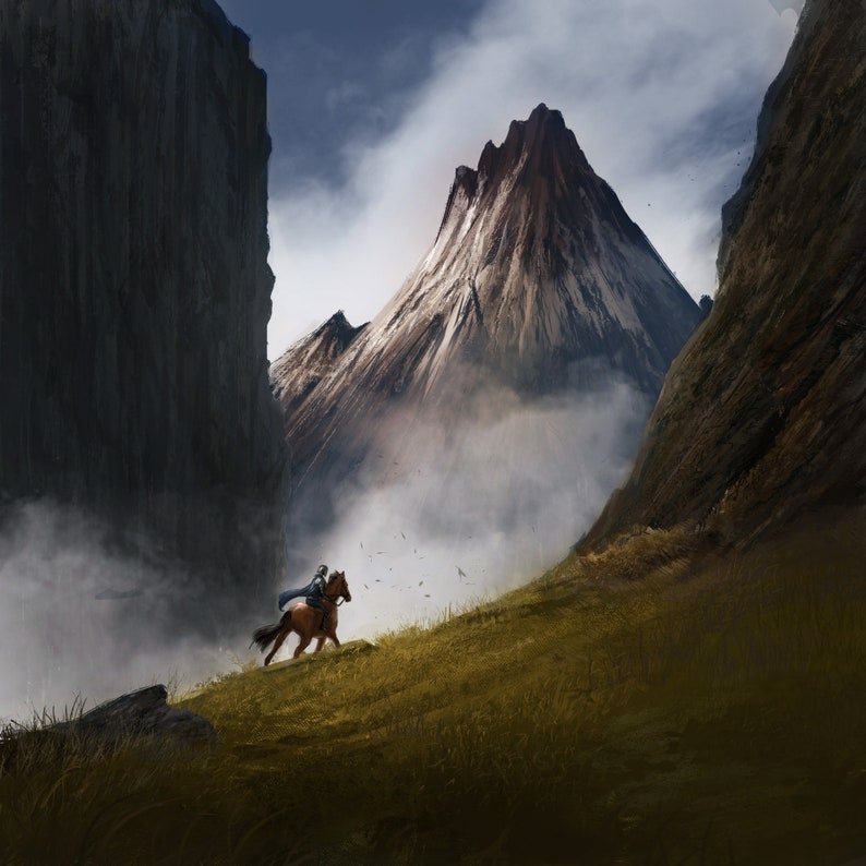 May include: A lone rider on horseback gallops through a misty mountain valley. The rider is wearing a dark cloak and the horse is brown. The mountains are rocky and snow-capped, with a dramatic peak in the background.