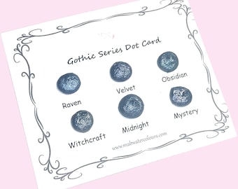 May include: A white card with the text "Gothic Series Dot Card" and six dark blue watercolor dots labeled Raven, Velvet, Obsidian, Witchcraft, Midnight, and Mystery. The card has a decorative border and the website www.malwatercolours.com.
