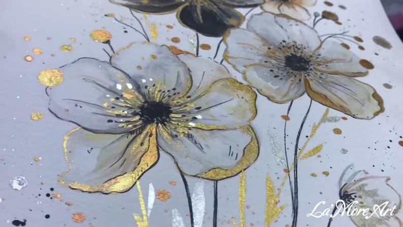 May include: A watercolor painting of white flowers with gold accents on a white background. The flowers have black centers and are surrounded by gold and silver glitter.