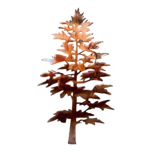 May include: A copper-colored metal silhouette of a pine tree with a detailed design. The tree is cut out of metal and has a rustic, weathered look.