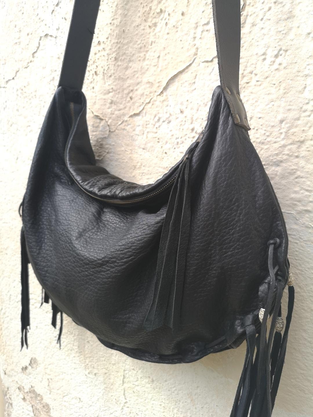 Black leather handmade hobo bag with fringe and bead detail. Etsy