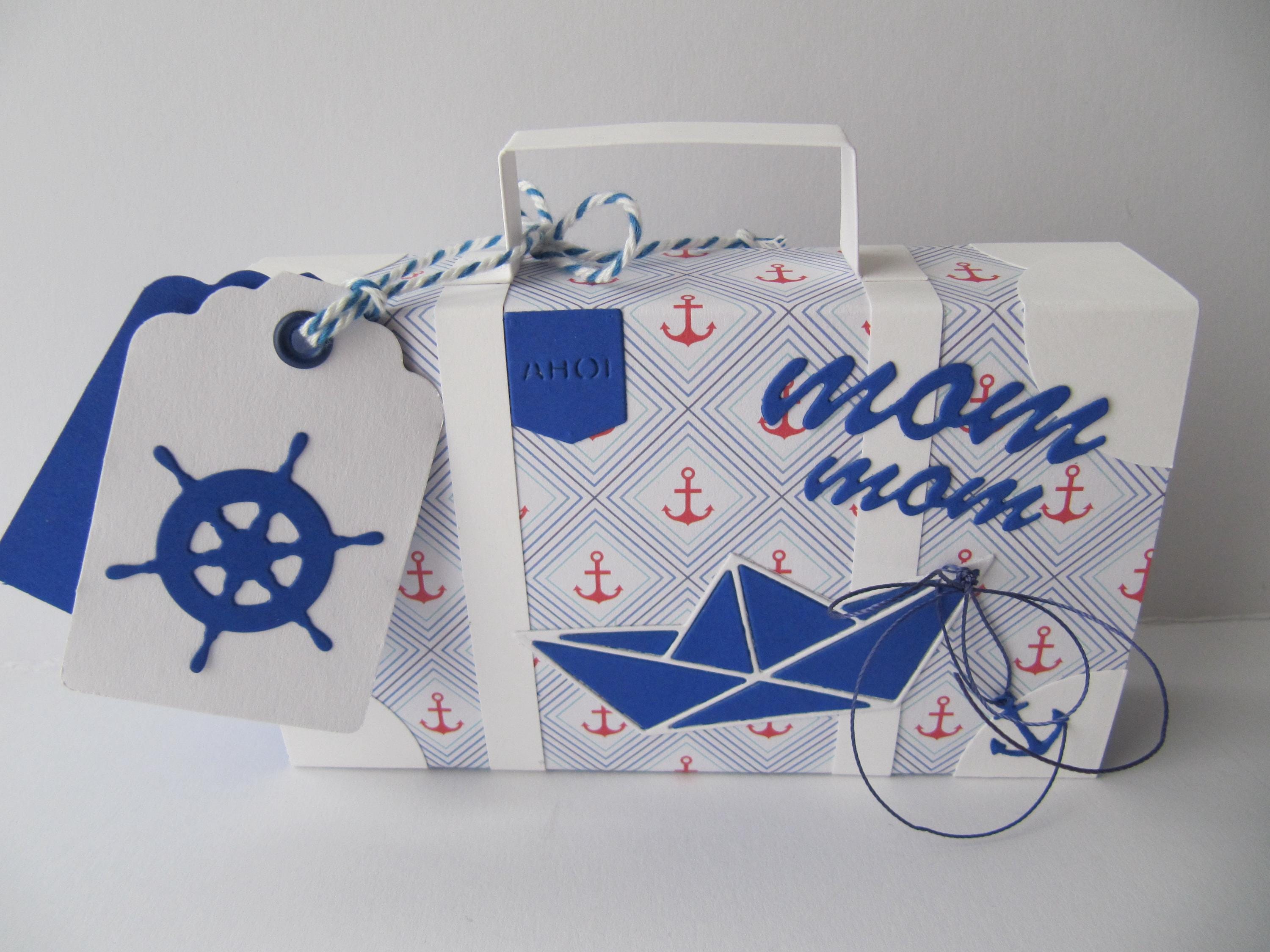 Travel suitcase as gift wrapping and card for a cash gift for a holiday or for a travel voucher, birthday or retirement