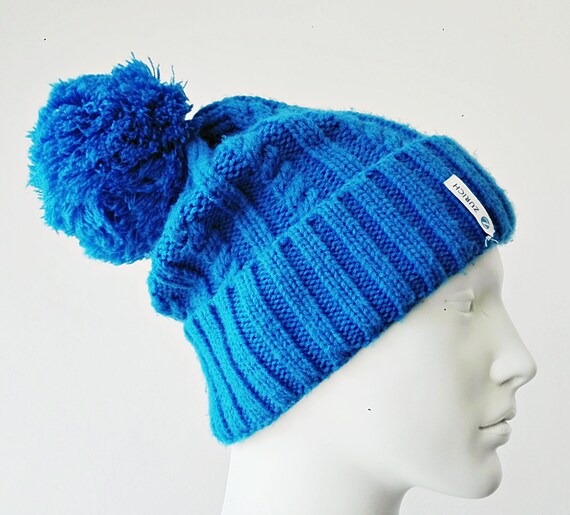 blue hat with pom pom