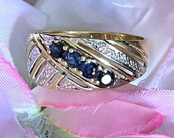 18k yellow gold ring with 4 sapphires surrounded by 6 diamonds