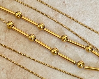 Chain decorated with 18k yellow gold rods and balls, length 43 cm