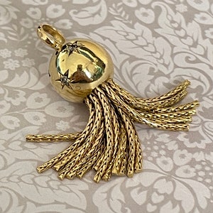Vintage pendant with a sphere and tassel in 18k gold and diamonds