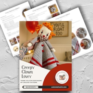 May include: A handmade crochet clown lovey doll with orange hair and a red nose, held in front of a sign that reads "YOU'LL FLOAT TOO." The doll has a gray body with red stripes and buttons. The image includes a flyer with the text "Creepy Clown Lovey."