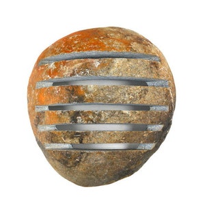 May include: A rounded, weathered stone with horizontal, evenly spaced grooves. The stone's surface displays a mix of orange, brown, and gray hues. The grooves appear to be filled with a lighter gray material, creating a contrast.
