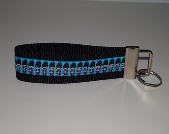 Lanyard Bobby Union Jack Queen Flag England London turquoise woven ribbon on black webbing