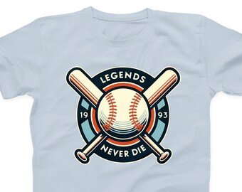 May include: Light blue t-shirt with a baseball themed graphic. The graphic features a baseball with crossed bats, a blue circle with the text "LEGENDS" at the top, "19" and "93" on either side of the ball, and "NEVER DIE" at the bottom.