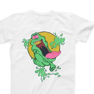 May include: White t-shirt with a green ghost character with a pink tongue and yellow eyes. The ghost is surrounded by green splatters and a yellow circle.