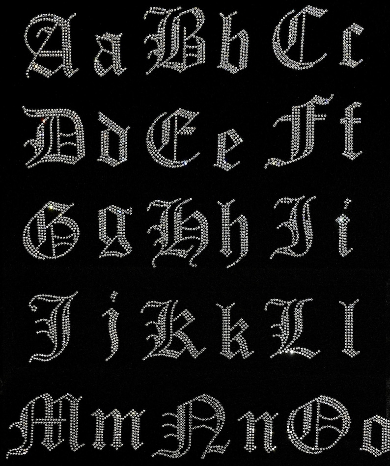 May include: A set of 26 silver rhinestone letters in an old English font. The letters are arranged in alphabetical order, starting with A and ending with Z.