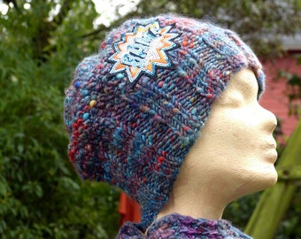 Hand knitted beanie, with appliqué, made of hand-spun yarn