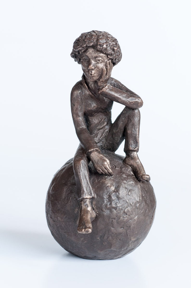 Whistling on ball, bronze sculpture image 1