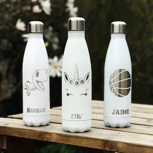 May include: Three white insulated water bottles with silver lids. One bottle features a dinosaur graphic and the name "MARCELLO". Another has a unicorn design with the initials "EMW". The third bottle displays a basketball graphic and the name "JAIME".