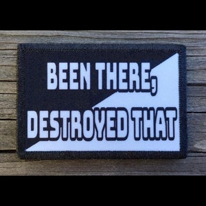 May include: Black and white patch with the text "Been There, Destroyed That" in white letters with a black outline.
