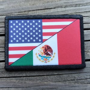 May include: A rectangular patch featuring a split design of the American and Mexican flags. The American side displays the blue field with white stars and red and white stripes. The Mexican side shows the green, white, and red colors with the Mexican coat of arms.