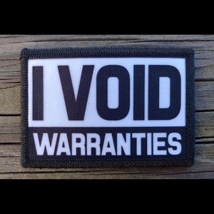 May include: Black and white patch with the text "I VOID WARRANTIES" on a white background with black text.