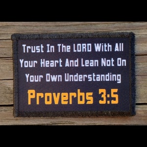 May include: A black rectangular patch with white text that reads "Trust In The LORD With All Your Heart And Lean Not On Your Own Understanding Proverbs 3:5". The text "Proverbs 3:5" is in orange.