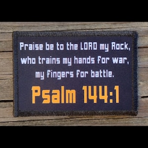 May include: Black patch with white text that reads "Praise be to the LORD my Rock, who trains my hands for war, my fingers for battle. Psalm 144:1"