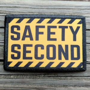 May include: A set of three ceramic mugs with a speckled, matte finish. The mugs are in shades of cream, light gray, and dark gray. Each mug has a simple, modern design and a rounded handle. The mugs are stacked on top of each other.