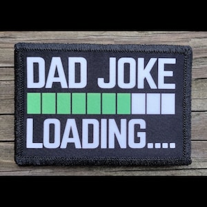 May include: Black and white patch with the text "DAD JOKE LOADING..." and a green progress bar.