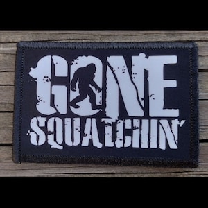 May include: Black and white patch with the text "GONE SQUATCHIN'" and a silhouette of Bigfoot walking.