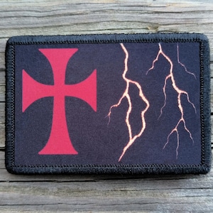 May include: Rectangular patch with a black border. The patch features a red Templar cross on the left and a lightning bolt design on the right, set against a dark blue background.