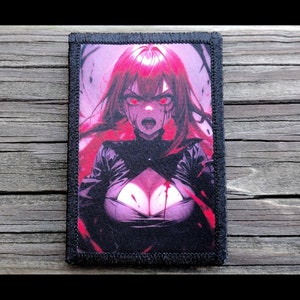 May include: A rectangular patch featuring a vibrant anime-style illustration of a woman with red hair and eyes, with blood dripping from her mouth and chest. The patch has a black border and is set against a wooden background.
