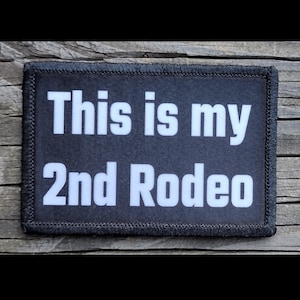 May include: Black patch with white text that reads "This is my 2nd Rodeo".