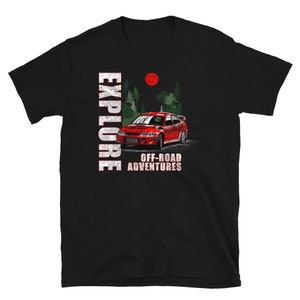 May include: Black t-shirt featuring a red car and trees printed on the front. The text "EXPLORE OFF-ROAD ADVENTURES" is printed below the car.