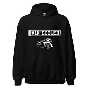 May include: Black hoodie featuring a white graphic of a car and the text "AIR COOLED" in a rectangular design. The car graphic has red and white accents. The hoodie has a drawstring hood.