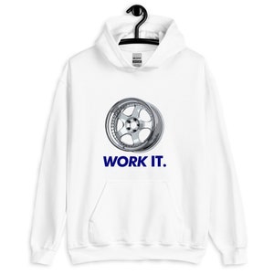 May include: White hooded sweatshirt with a chrome car wheel graphic. The blue text "WORK IT." is printed below the wheel. The sweatshirt includes a front pocket and a drawstring hood.