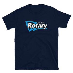 May include: Navy blue t-shirt with a graphic design. The design features the word "Rotary" in white, with a blue and black outline, and Japanese characters above. The shirt is made of a soft material.