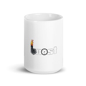 May include: White ceramic mug featuring a black and orange turbocharger graphic and the word "boost". The design includes a gauge and flames, suggesting a theme related to automotive performance or speed.