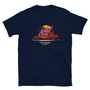 May include: Navy blue t-shirt with a red sports car graphic, the text "NSX" and "THE ORIGINAL JAPANESE SUPERCAR". The design includes a sunset and palm trees. The shirt is made of soft material.