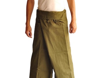 May include: A person wearing a white tank top and a green wrap skirt. The skirt has a pocket on the front.