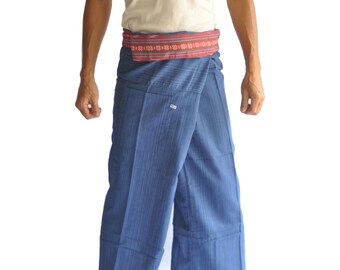 May include: Blue wrap pants with vertical stripes and a red and white patterned belt. The pants are wide-legged and appear to be made of a lightweight fabric. The model is wearing a white tank top.