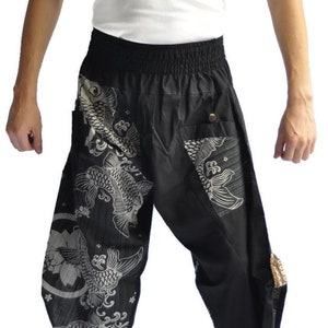 May include: Black pants with a white koi fish print. The pants have an elastic waistband and a drawstring.