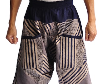 May include: A pair of blue and beige patterned trousers with a wide leg and elastic waistband.